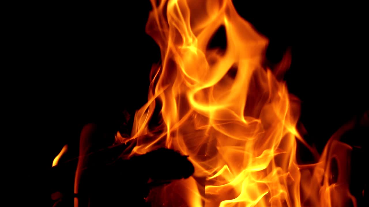 Burning Wood. Flame heats the rural farmhouse. Slow motion