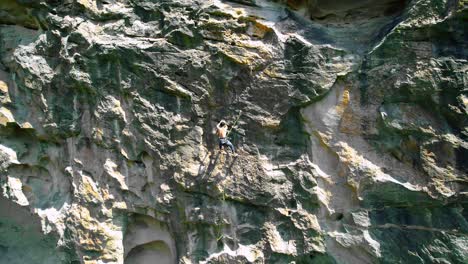 guy climbing to top of mountain