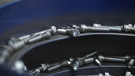 close-up of screws in a blue container