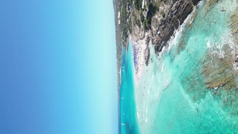 People-relax-and-swim-at-La-Pelosa-beach,-Sardinia