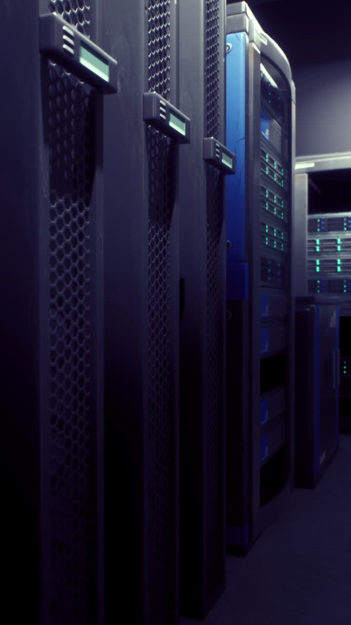 Server room with high tech equipment illuminated by blue lights at night