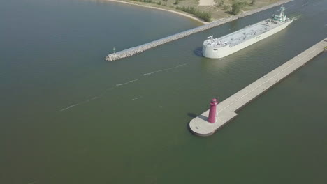 aerial view of freighter moving out of canal in michigan, usa