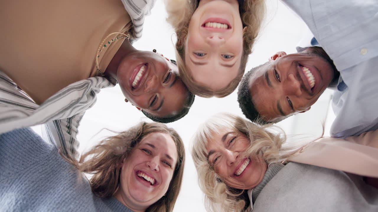 Diverse group of smiling people in huddle