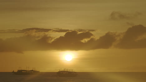 Static-Shot-Of-Passenger-Boats-In-Silhouette-Sailing-In-Boracay-While-Sunset