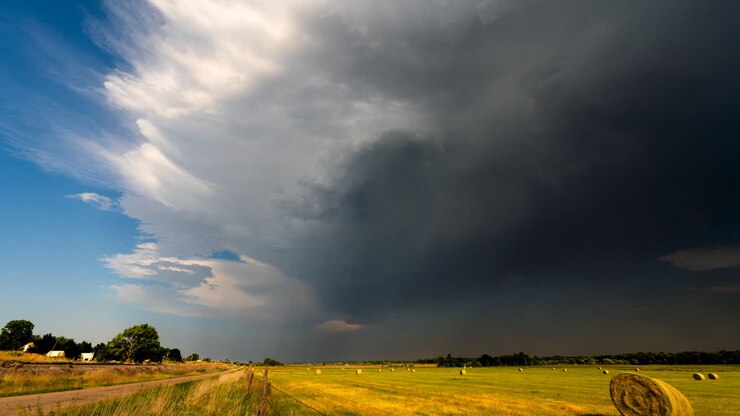 Bright sunshine turns to dark as storm clouds move in time lapse