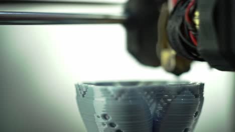 innovative 3d printing process captured in two frames showcasing intricate layering and precision craftsmanship in a modern production environment