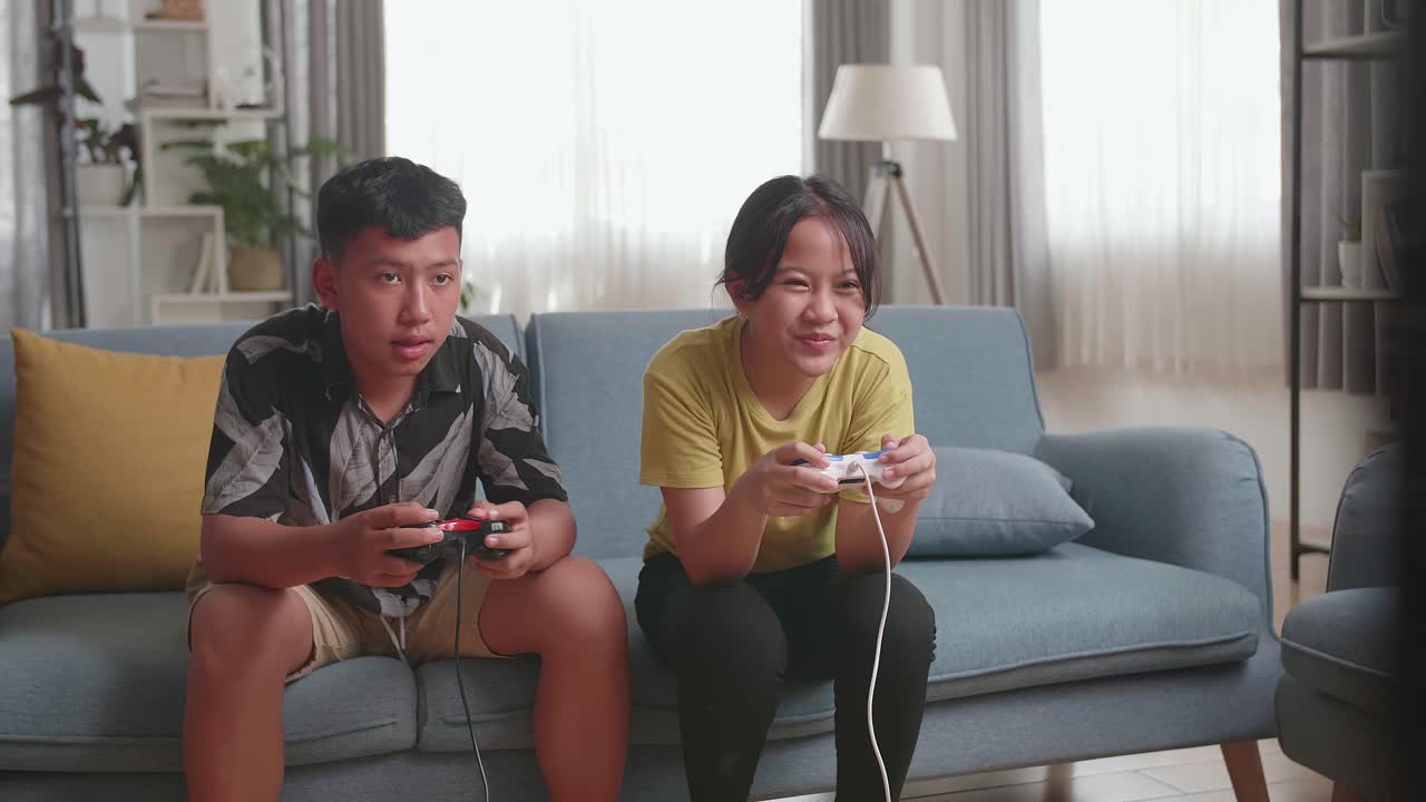 Siblings Playing Video Games