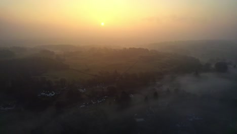 Thick-morning-mist-over-the-Cumbrian,-Lake-District-town-of-Bowness-on-Windermere