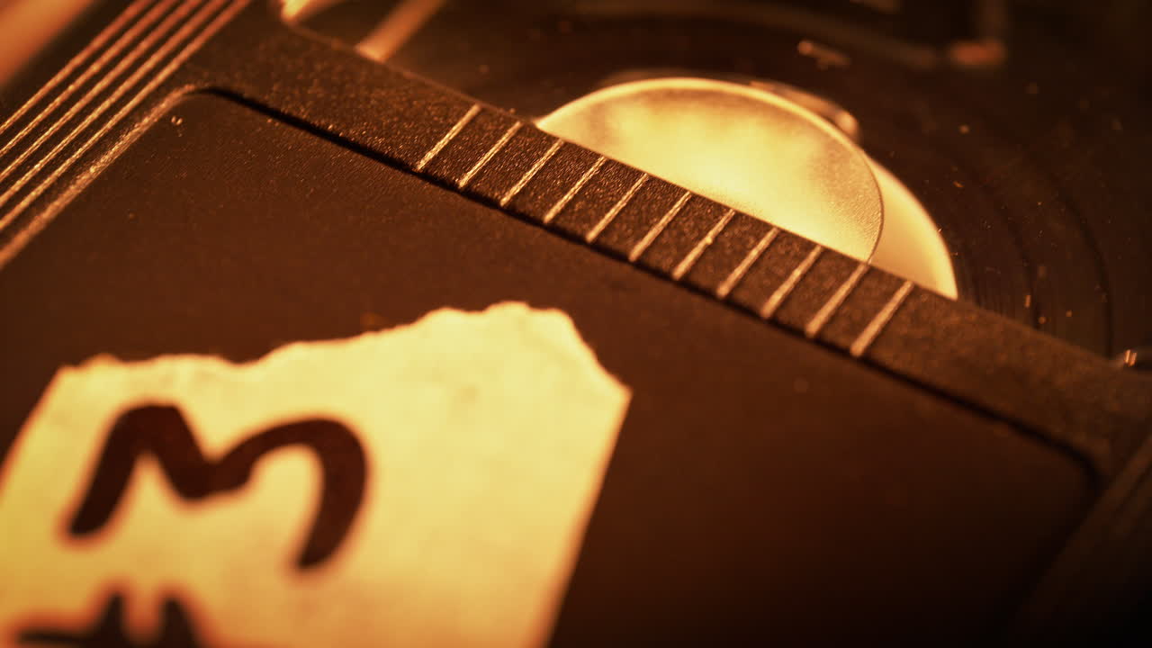 Labeled VHS Video Cassette is Inserted into the VCR, the Tape Winds onto the Take-Up Reel - Macro, 90s Vibe