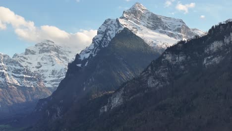 Experience-the-breathtaking-view-of-a-majestic-mountain-range-in-Switzerland,-showcasing-its-grandeur-and-snow-capped-peaks