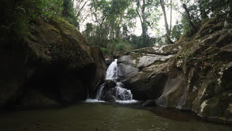 Slow-motion-video-of-a-hidden-waterfall-in-the-jungle-of-Minca,-Colombia