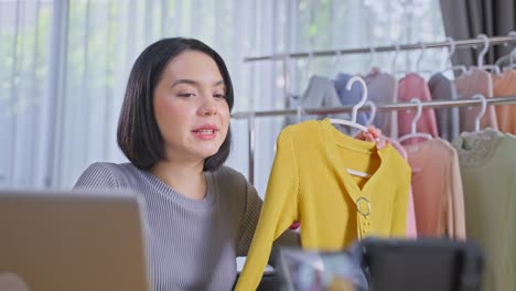 fashion influencer reviewing a yellow cardigan