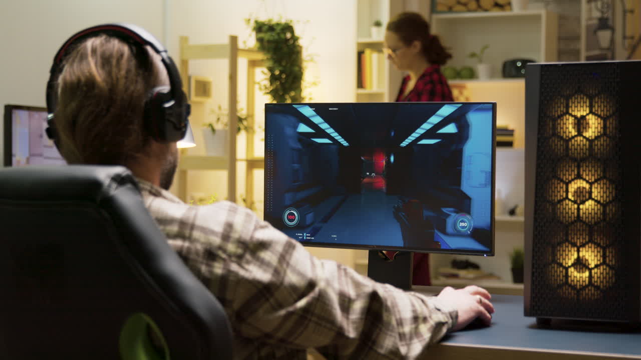 Man Playing Video Games at His Computer