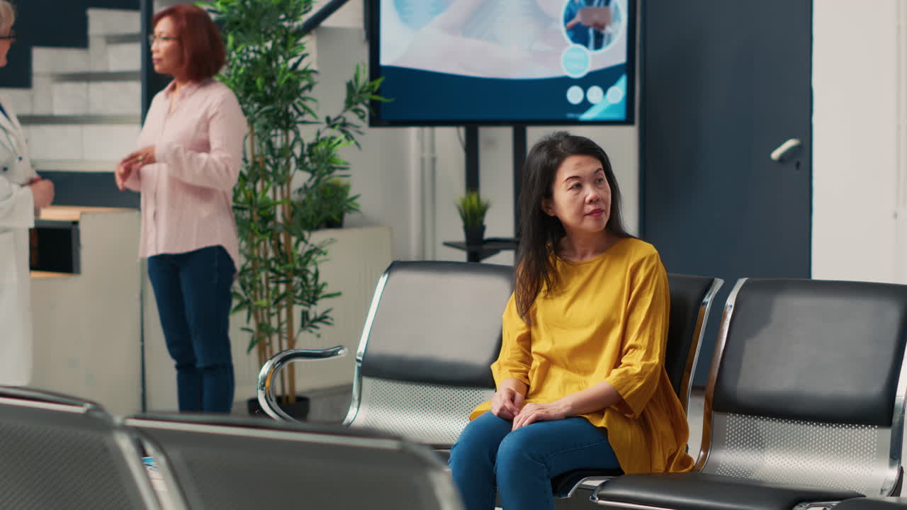 Doctor explaining x-ray to patient in waiting room