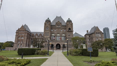 hyperlapse of ontario legislative building in toronto with looming stormy, overcast sky behind