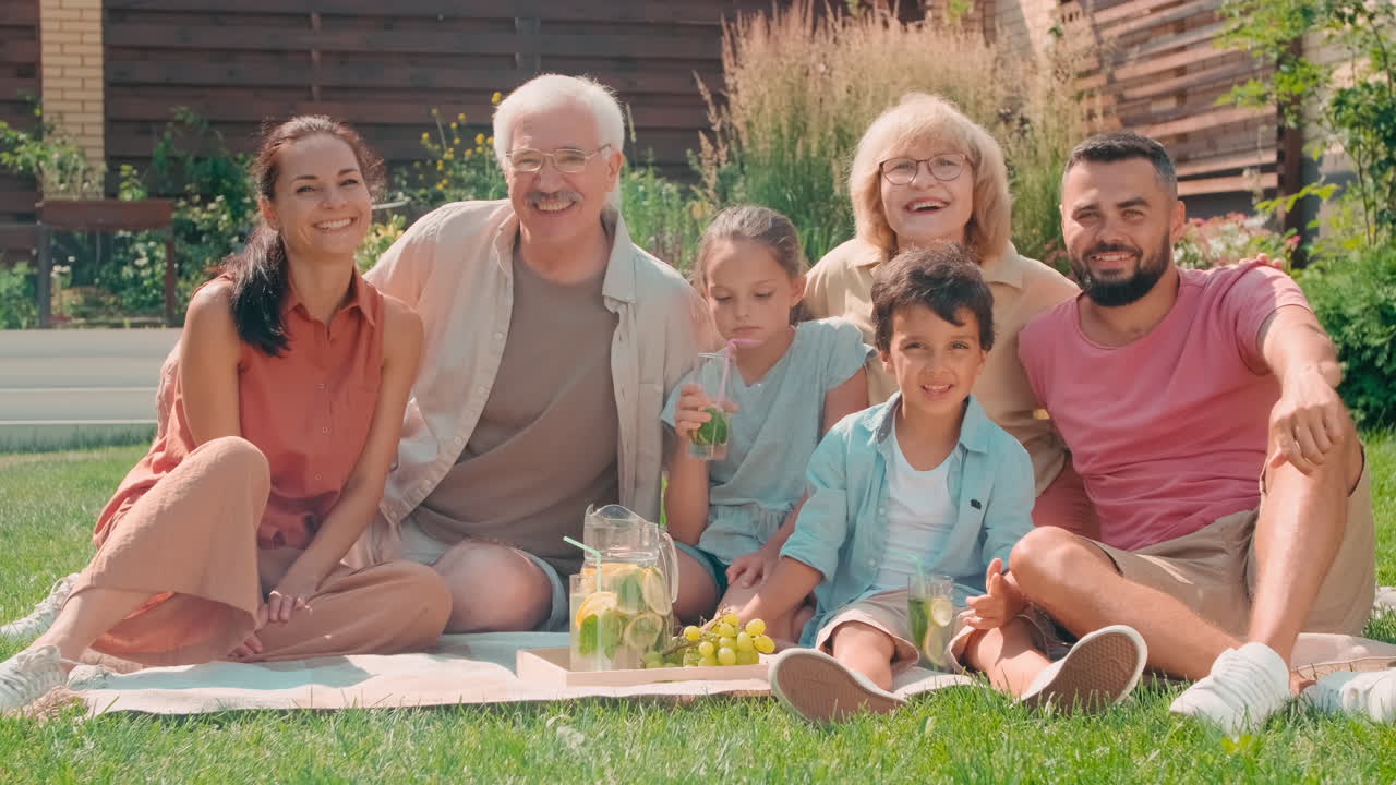 Portrait Of Happy Big Family On Picnic Outdoors