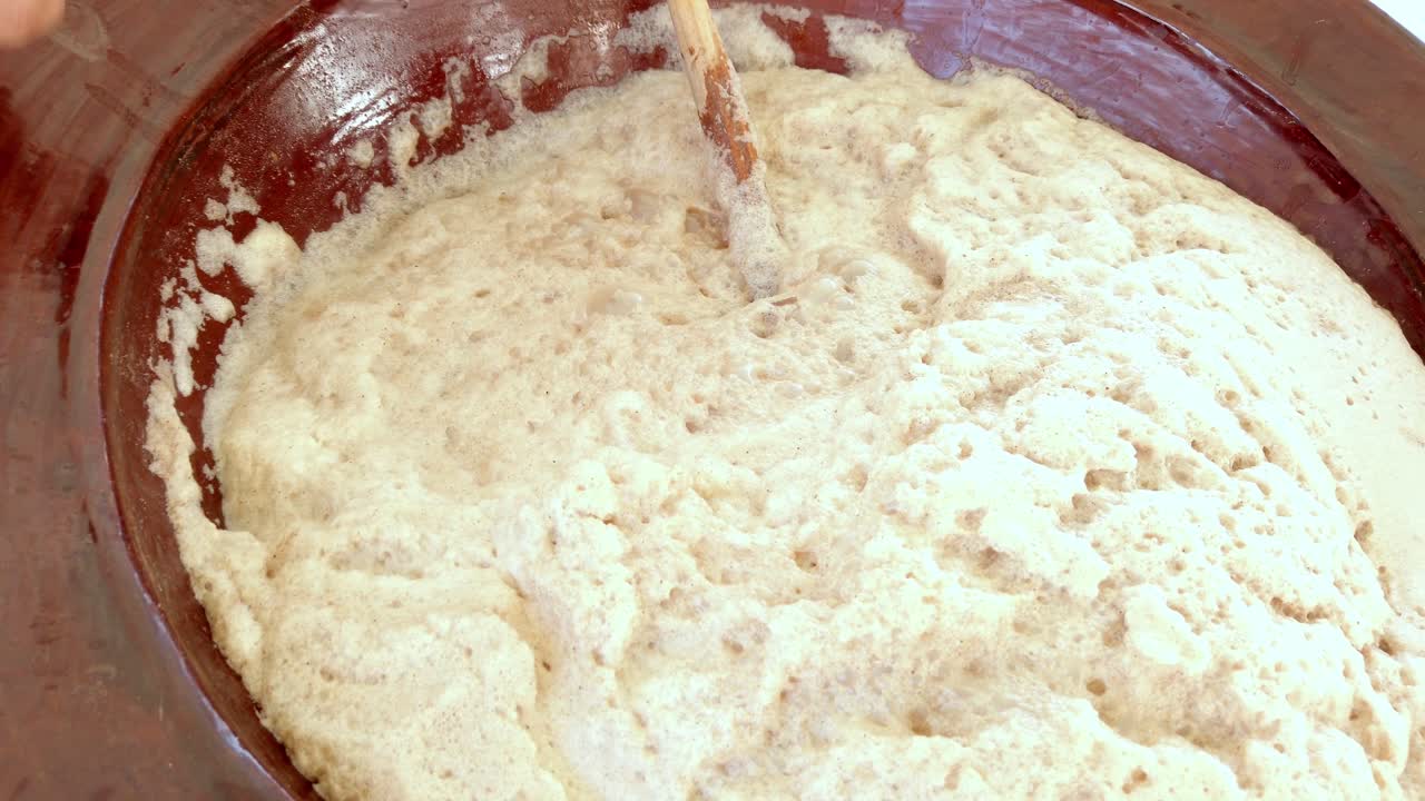 Mixing dough for traditional Cholula festival bread outdoors