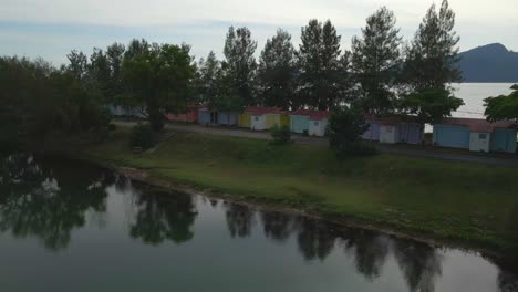 view of the beauty of a row of seafront villas in the evening, marina island, malaysia. water reflection.