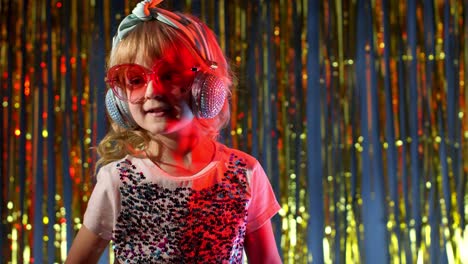 stylish trendy child kid girl at disco party cyberpunk club with pineapple fruit drinking juice