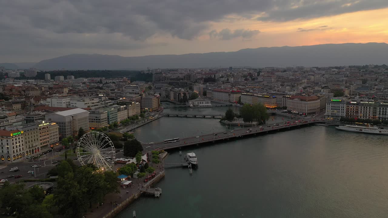 twilight time geneva city center lakeside traffic bridge ferris wheel aerial panorama 4k switzerland