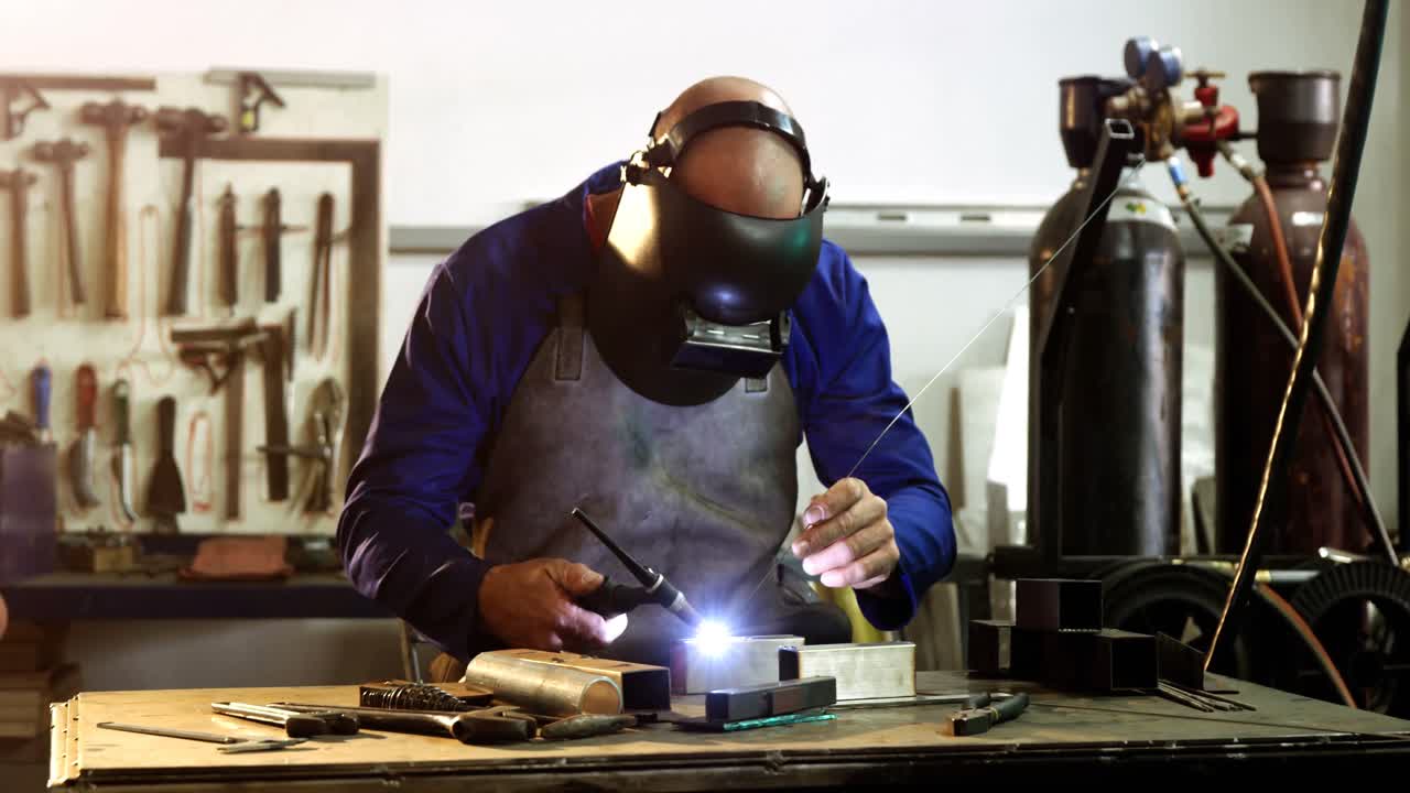 Male welder working on a piece of metal
