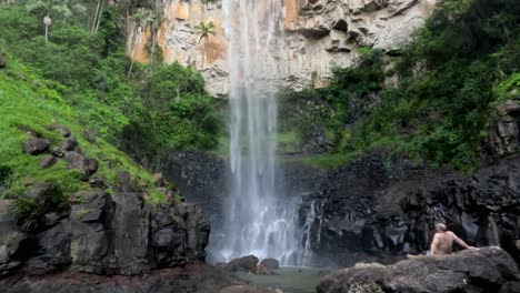 person enjoying a scenic waterfall view