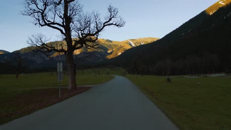 POV-point-of-view-car-drive-in-Alps-valley-mountain-peaks-in-Austria-Tyrol-with-romantic-and-scenic-roads-in-natural-autumn-landscape