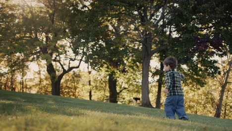 cute asian kid walking in the park, having a good time