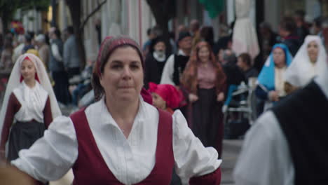 sardinian culture. close up of  women with traditional scarf in sant'antioco