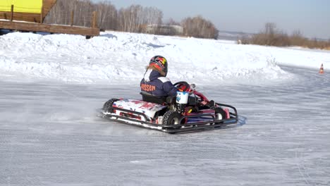 kid go-karting on frozen ice