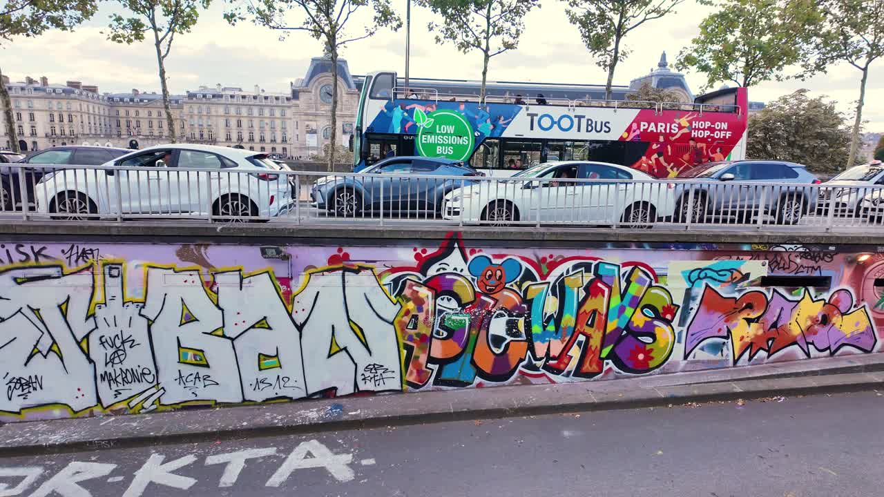 Graffiti street art spray paint in Paris France writing drawing on wall