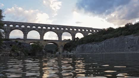 beautiful aqueduct in france with river water flowing under bridge