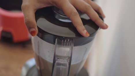 person using a blender