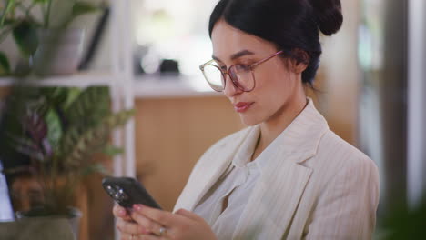 Woman-Scrolling-Through-Social-Media-on-Smartphone