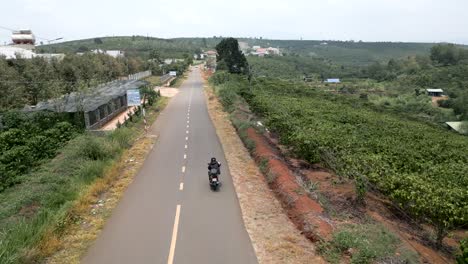 motorcycle ride through a coffee plantation landscape in vietnam