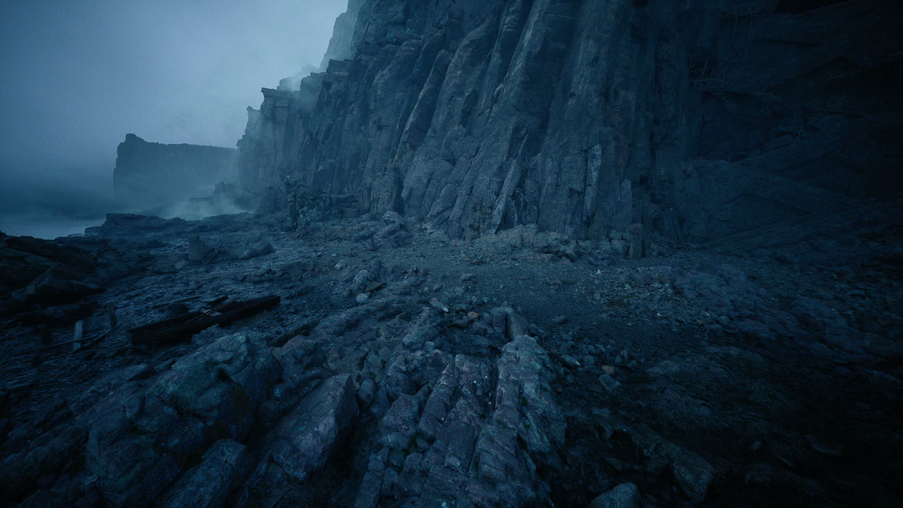 Twilight showcases sharp cliffs as thunderheads rush along shore