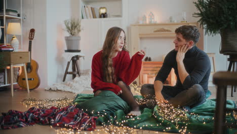 woman talking with friend amidst illuminated lights