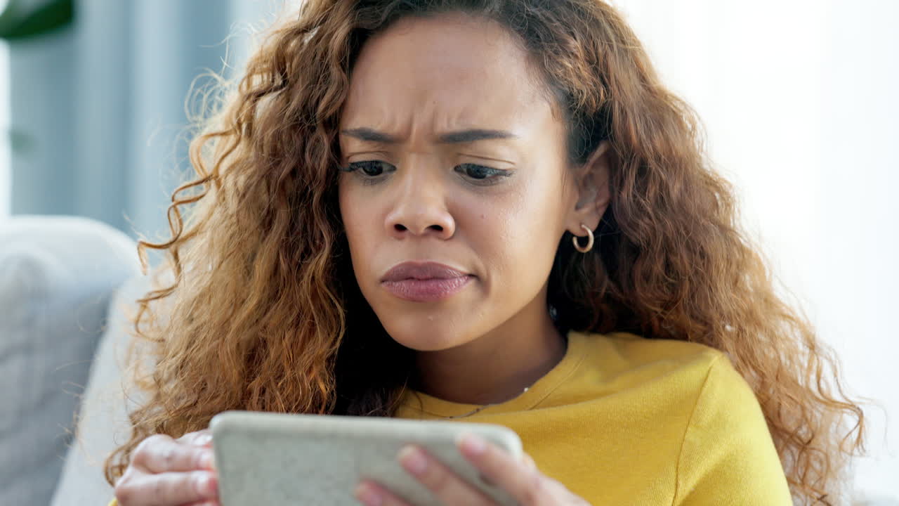 Trendy girl watching video on her phone looking