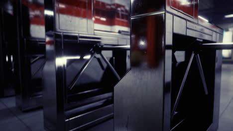 modern turnstiles in a subway station during quiet hours