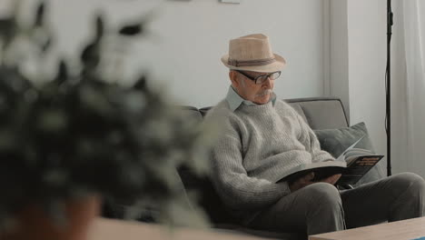 elderly man reading a book