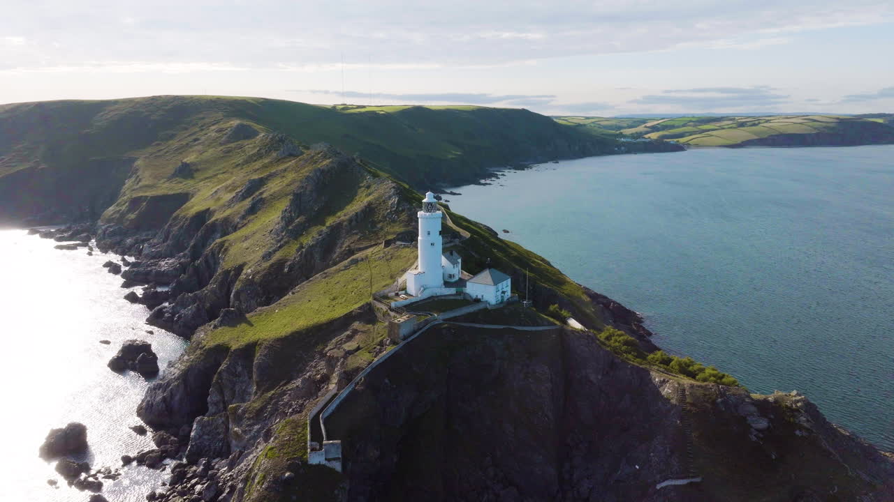Aerial View of a Lighthouse on a Coastal Cliff