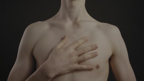 Male-breathing-with-hand-on-chest-shot-in-4K