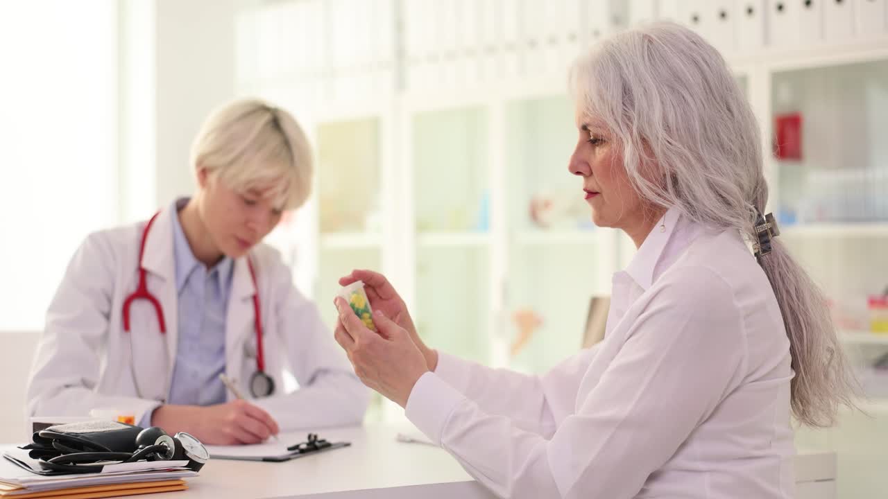Doctor Consulting with Senior Patient about Medication