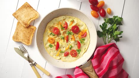 tasty homemade classic omelet with cherry tomatoes