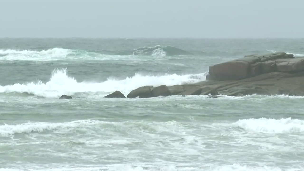 Stormy Waves Crashing on Rocks