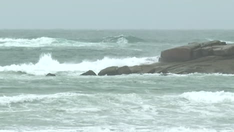 stormy waves crashing on rocks