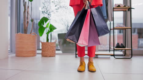 retail, shopping bag and shoes of person in store