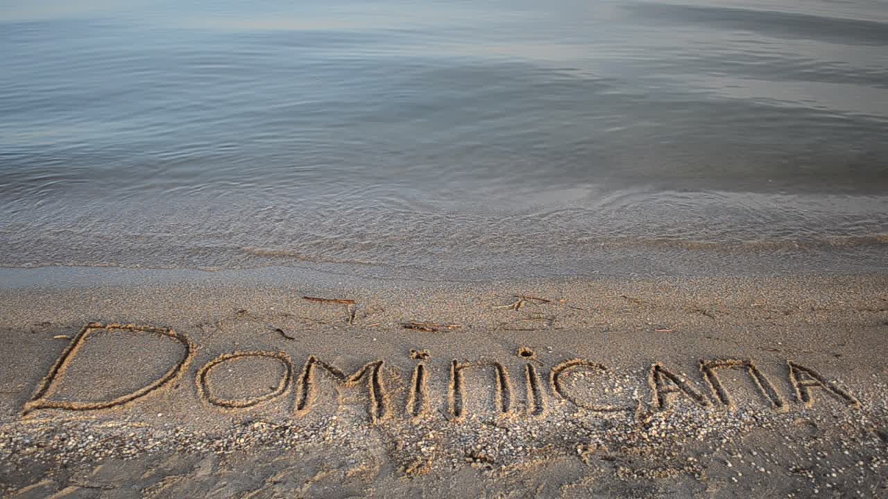Dominicana the inscription on the sand. Inscription on sand, the beach