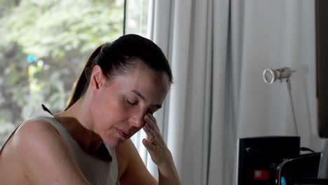 middle-aged woman feels drained, frustrated and fatigued