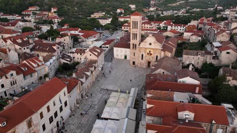 hvar, croatia, showing rooftops and a church in the town square, aerial view